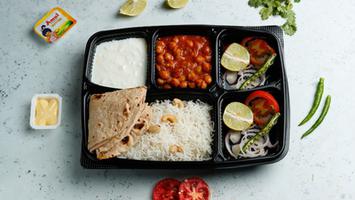 Cholley or Rajma, Rice, Roti 2, Salad, Raita