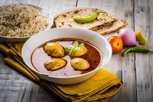 Anda Curry, Rice, 2 Roti, Salad, Raita