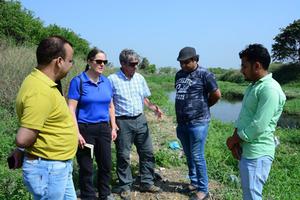 Visiting international delegates along the Kali River.